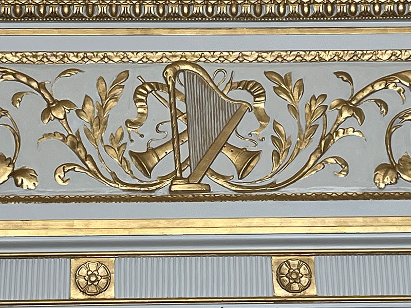 Figure 2. Detail of plaster work above the doorway in the Music Room. Image courtesy of Nemours Estate.