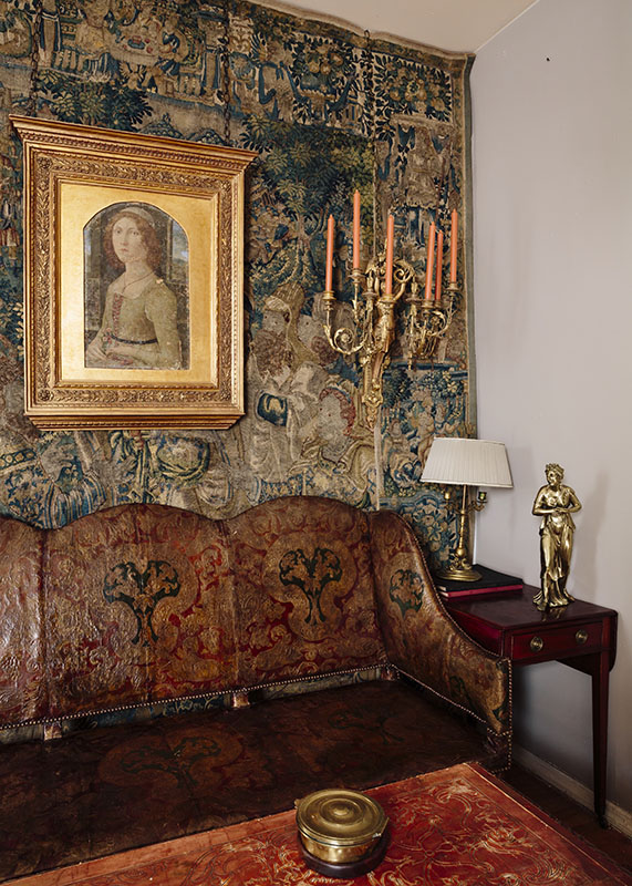 Italian giltwood sconces and a 16th-century Flemish tapestry in the apartment of dealer Collier Calandruccio in Brooklyn’s Crown Heights neighborhood. Photo by Brian W. Ferry.