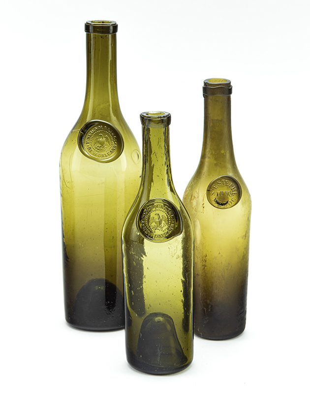 Figure 6. F. Seignouret & Co. (New Orleans) Wine Bottles, c. 1840. Non-lead glass. New Orleans Museum of Art, Gift of Hugh J. Smith Jr, 93.381, 93.382. Image courtesy the New Orleans Museum of Art (NOMA). Above: Figure 7. “New Orleans” goblet, 1840–50, probably Bohemia (today’s Czechoslovakia). Glass, ruby stained, engraved. New Orleans Museum of Art, Museum purchase, William McDonald Boles and Eva Carol Boles Fund, 2004.50. Image courtesy the New Orleans Museum of Art (NOMA).