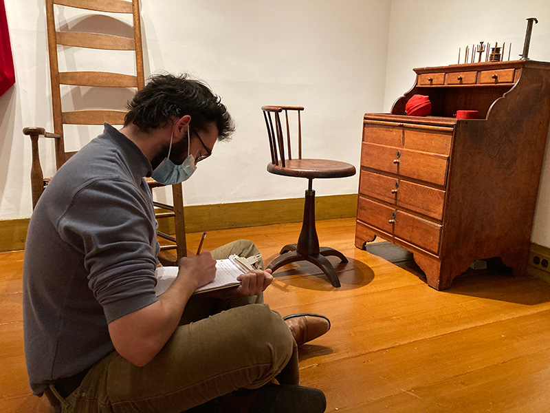 Peter studies a 19th-century Shaker work desk at Winterthur.