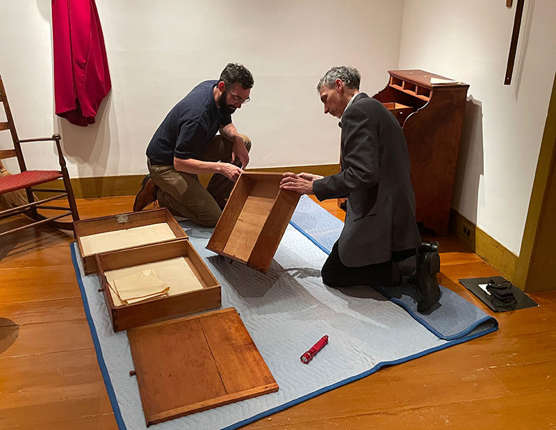 Josh Lane, Winterthur’s curator of furniture, confers with Peter about details of the desk.
