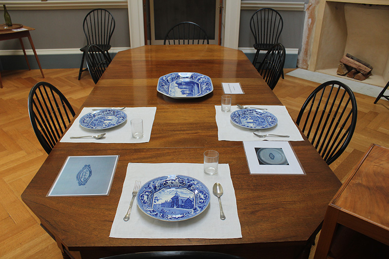Figure 8. Three-part octagonal dining room table with Jefferson-designed Windsor chairs. The plates feature scenes of Oxford and Cambridge contained within an octagon. (J. & W. Ridgeway, Stoke-on-Trent, England, c. 1815. Transfer printed earthenware.)