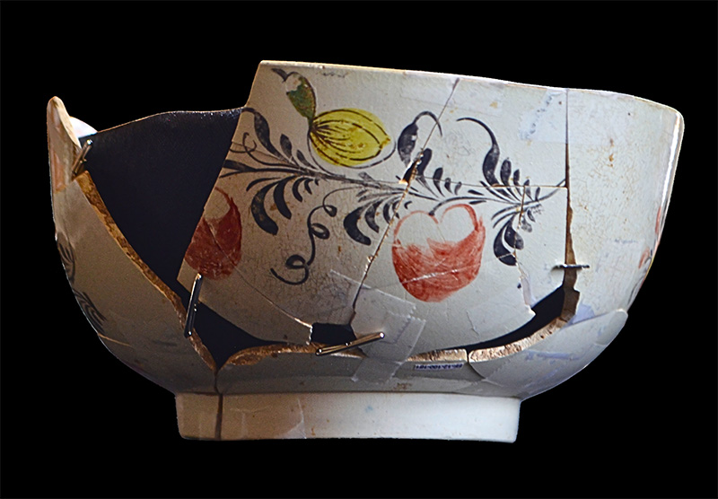 Figure 2. Punch bowl, c. 1760–80, England. Creamware. H 3 in., Diam. 6 in. Creamware with hand-painted decoration. Recovered by archaeologists from the cellar of the Washington House at Ferry Farm, Fredericksburg, VA. Courtesy, The George Washington Foundation, vessel #469.